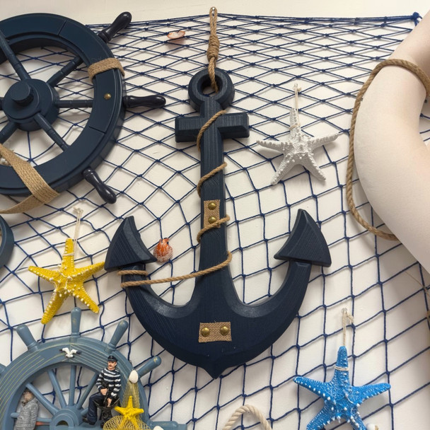 A professional product presentation of the authentic navy blue wooden nautical anchor wall decoration from a premier art, gift, and home decor supplier.
