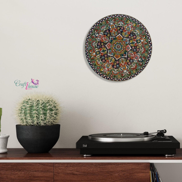 A premium 25 cm hand-painted enameled clay plate titled "The Scholar’s Bloom" featuring vibrant turquoise and yellow embossed floral patterns.