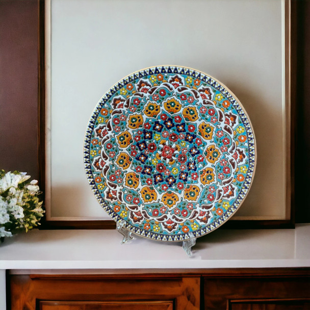 A stunning blue and white hand-painted Persian pottery plate displayed on a living room wall