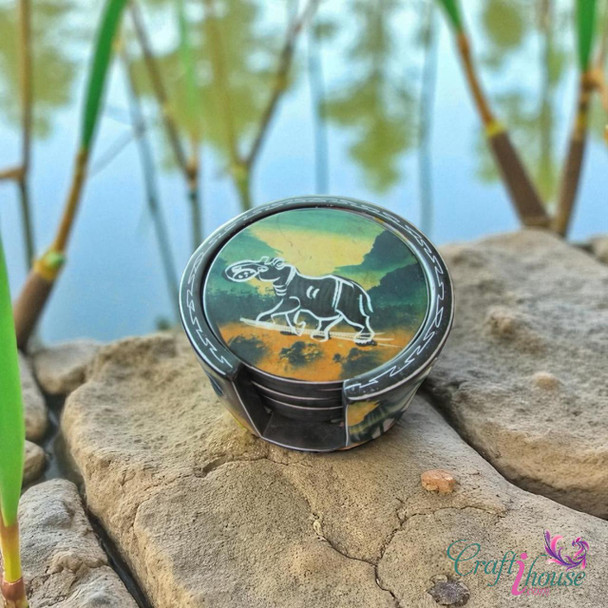 A premium 6-piece hand-painted African soapstone tea coaster set titled "The Serengeti Circle" in its matching hand-carved stone case.