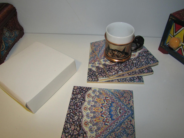 An artisan ceramic tea coaster set featuring a rich, ornate carpet print, perfect for adding a touch of heritage and color to any home decor setting.