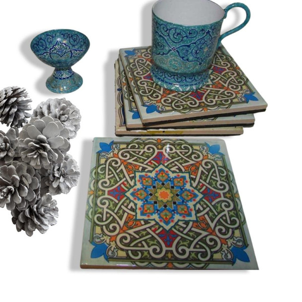 An artisan ceramic tea coaster set featuring a timeless interlocking geometric print, perfect for adding a touch of heritage and color to any home decor setting.