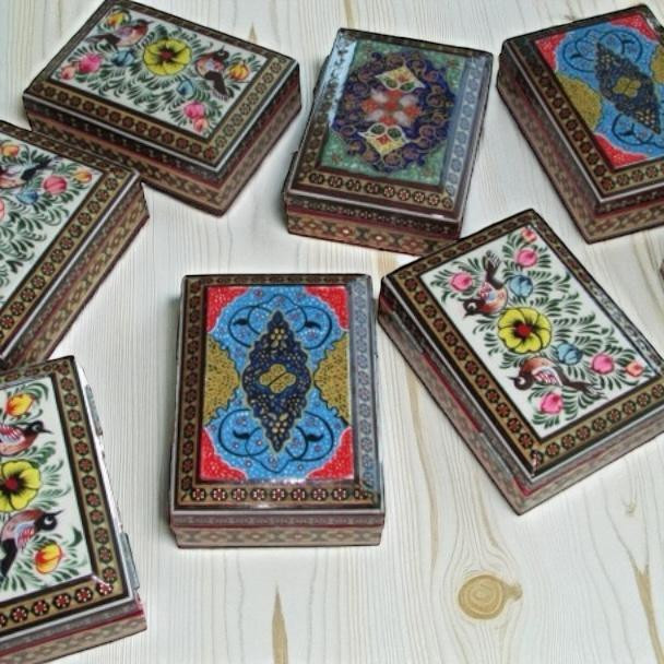 A premium 11x8x3 cm handmade Khatamkari wooden box titled "The Geometric Petal" featuring intricate brass inlay and hand-painted floral art.