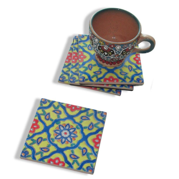 An artisan ceramic tea coaster set featuring timeless geometric floral patterns, perfect for adding a touch of heritage and color to any home decor setting.
