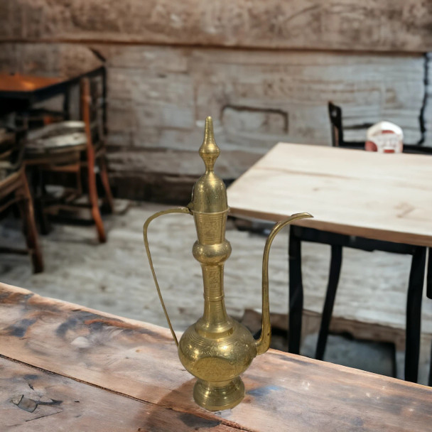 A majestic 80 cm handcrafted solid brass Arabic Dallah coffee pot featuring a traditional soaring lid and hand-etched patterns.
