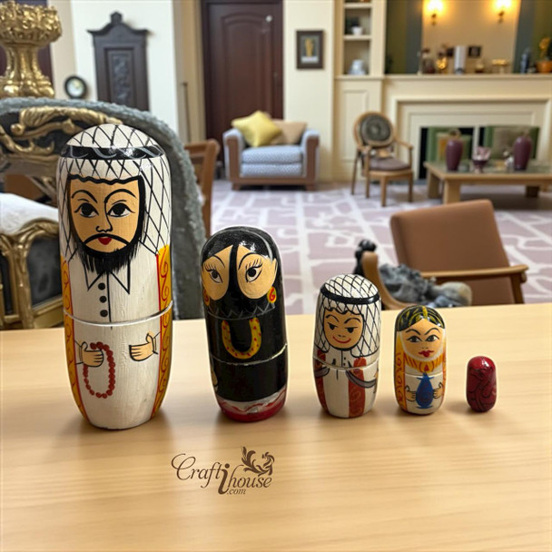 A premium 5-in-1 set of handmade Arabic wooden family dolls titled "The Desert Dynasty" featuring traditional UAE heritage designs.