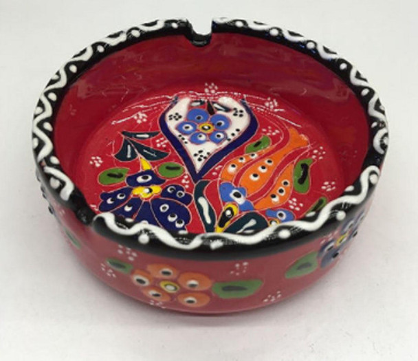 A handmade Turkish ceramic ashtray featuring vibrant hand-painted relief floral patterns and a high-gloss glaze.