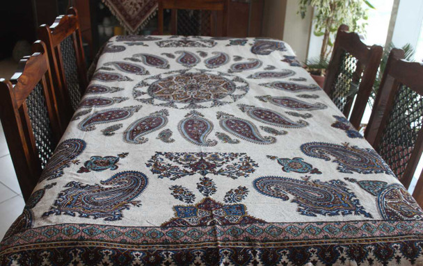 A premium 190x135 cm handmade cotton tablecloth featuring vibrant floral block-printed designs for luxury dining room decor.