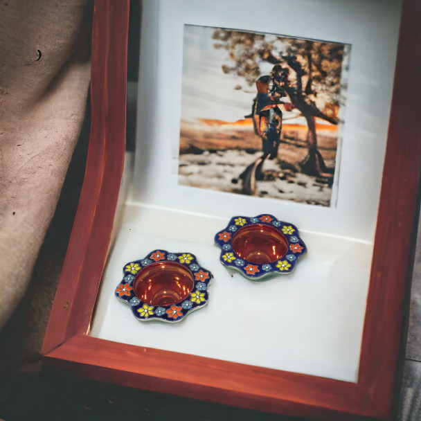 A set of 2 hand-painted ceramic candle holders with Persian enamel artistry — a beautiful housewarming, anniversary or new home gift.