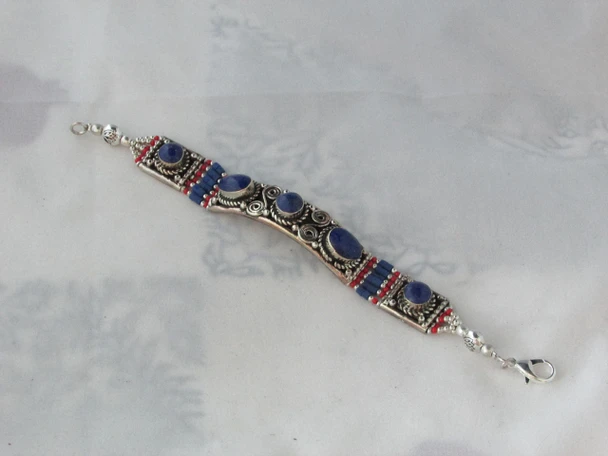 A stunning handcrafted bracelet showcasing traditional metalwork and natural stones, ideal as a luxury gift for any special occasion.