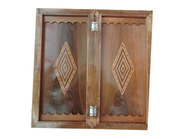 A large, thick-framed solid wood board showing the chess side with deep wood grain and heavy construction