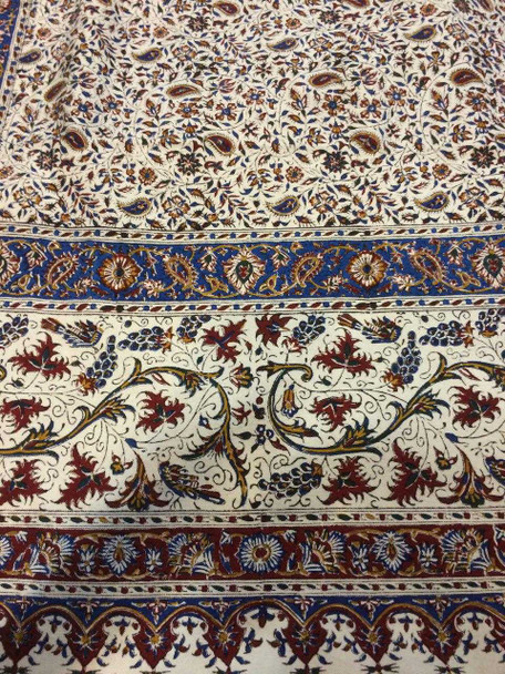 A detailed macro shot showing the slight organic variations of the hand-block printing on heavy cotton fabric