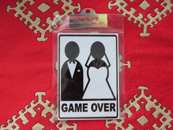 A vibrant 11x9 cm vertical aluminium fridge magnet featuring a humorous 'Game Over' wedding design with bride and groom silhouettes.