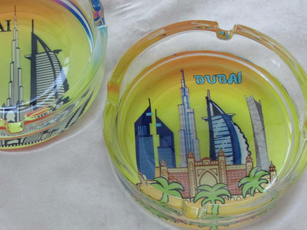 A 12 cm round glass ashtray featuring a high-definition panoramic design of the Dubai skyline.