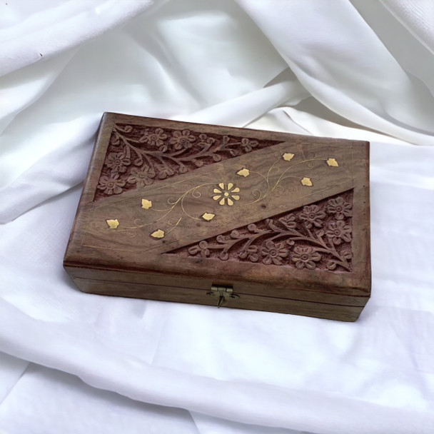 A 22x12 cm hand-carved wooden storage box featuring intricate floral woodcarving and polished brass inlay details, designed for oud and bakhoor.