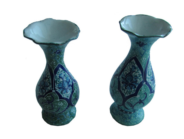 A small 8 cm handmade copper vase with intricate blue and white Minakari enamel floral patterns from Isfahan.