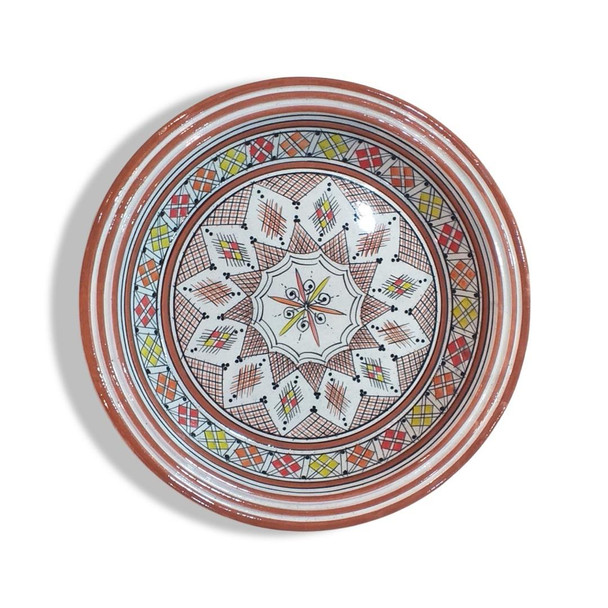 Moroccan ceramic plate featuring traditional blue and white geometric Fez patterns with a glossy finish.