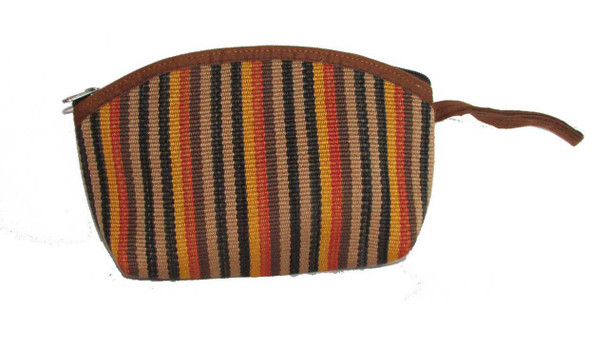A colorful handmade Kilim makeup bag with intricate geometric tribal weaving and a sturdy brass zipper.