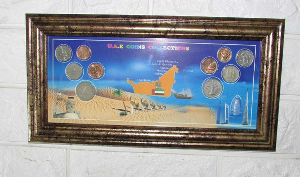 A premium 32x16 cm wooden frame featuring a panoramic display of silver-toned UAE coins and heritage icons.