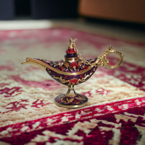 A mid-sized 12x8 cm purple and gold magic Aladdin lamp souvenir from Dubai made from zinc alloy.