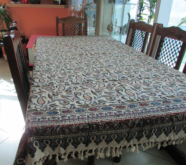 A rectangular Ghalamkar cotton tablecloth featuring hand-blocked Persian paisley and floral patterns