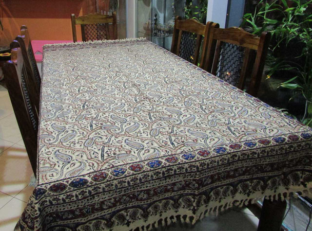 Close-up of the intricate corner borders and hand-knotted fringe of a 200x135 cm Persian cotton tablecloth.