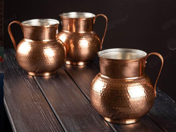 A premium 20 cm handmade pure copper jug featuring a brilliant hand-hammered honeycomb texture and a sturdy copper handle.