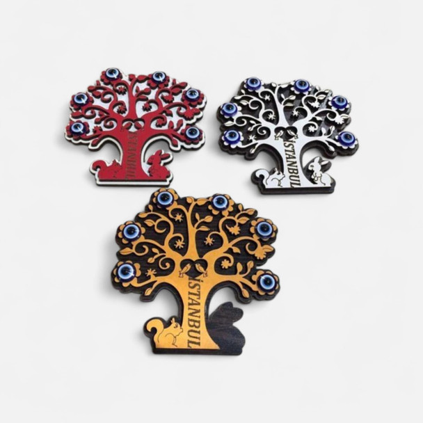 A close-up of the cute squirrel and rabbit silhouettes laser-cut at the base of the Turkish Tree of Life magnet.