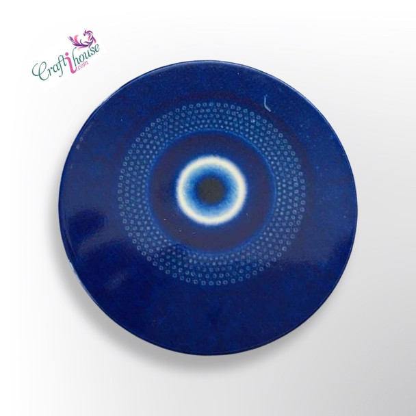 A Craftihouse branded circular ceramic coaster, beautifully adorned with a traditional Turkish Evil Eye motif.