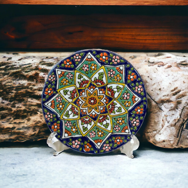 A gorgeous 15 cm handmade ceramic plate featuring vibrant hand-painted patterns and a food-safe high-gloss glaze for wall decor.