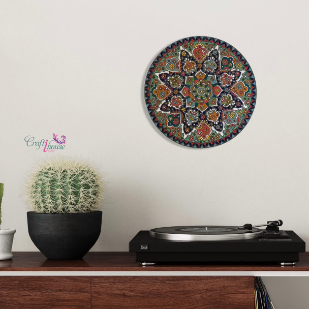 A premium 25 cm handmade ceramic plate featuring vibrant hand-painted patterns and a high-gloss protective glaze for unique wall decor.