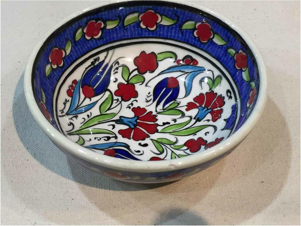 A premium 12 cm handmade Turkish ceramic bowl featuring vibrant red tulip patterns and a high-gloss food-safe glaze.