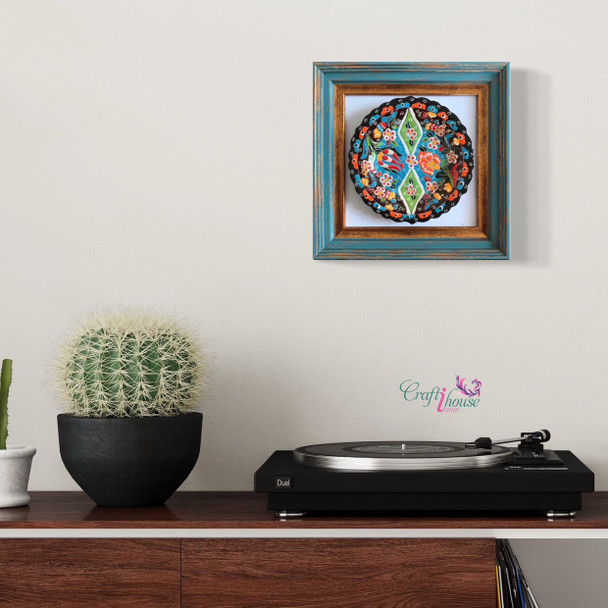 stunning 18 cm assorted pattern ceramic plate mounted inside a rustic turquoise and gold distressed wooden wall frame.
