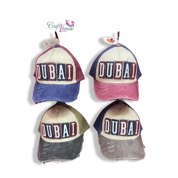 A professional product presentation of the Dubai distressed patchwork cap from a premier UAE art, gift, and souvenir supplier.