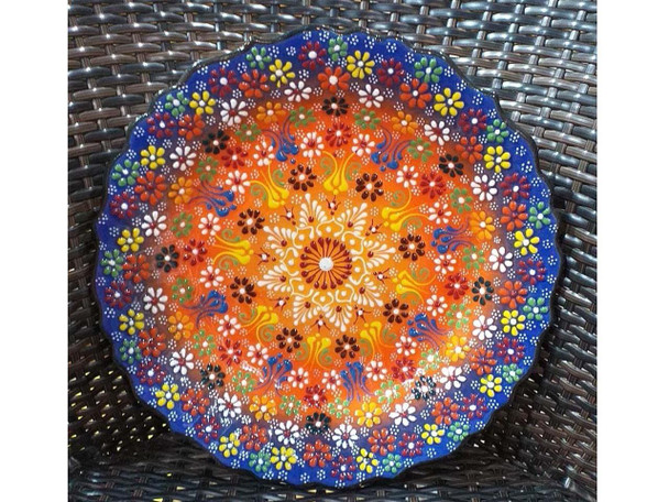 A professional product presentation of the exclusive 30 cm handmade assorted pattern wall and serving plate from a premier UAE gift shop.