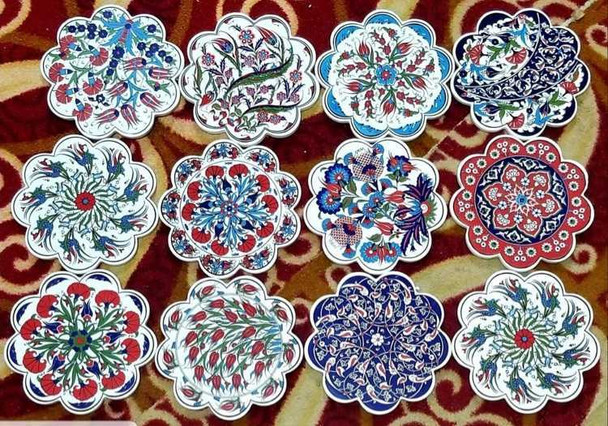 A selection of 9 cm assorted floral ceramic coasters, emphasizing the unique beauty and traditional artistic motifs in each piece.