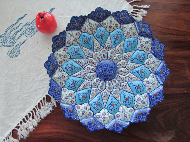 A premium 30 cm octagonal enamelled copper plate featuring vibrant hand-painted Meenakari floral patterns and a high-gloss finish.