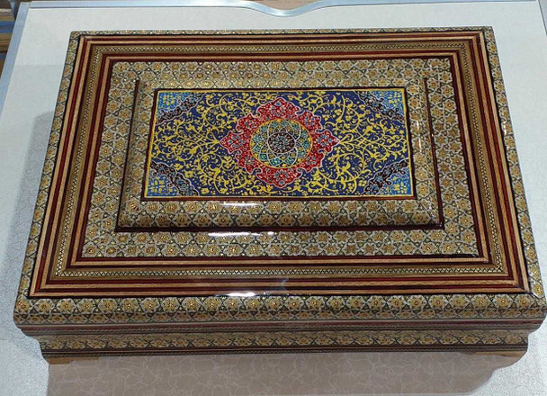 A professional product presentation of the exclusive handmade 40x30 cm Khatamkari storage and Quran box from a premier UAE shop.