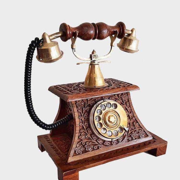 A professional product presentation of the exclusive handmade wooden telephone decor from a premier UAE shop.