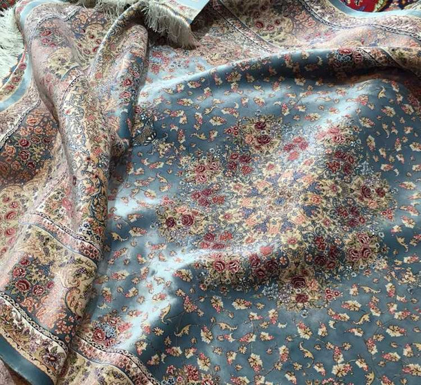 A large 225x150 cm premium silk-touch rug with a shimmering floral pattern styled in a luxury modern living room.