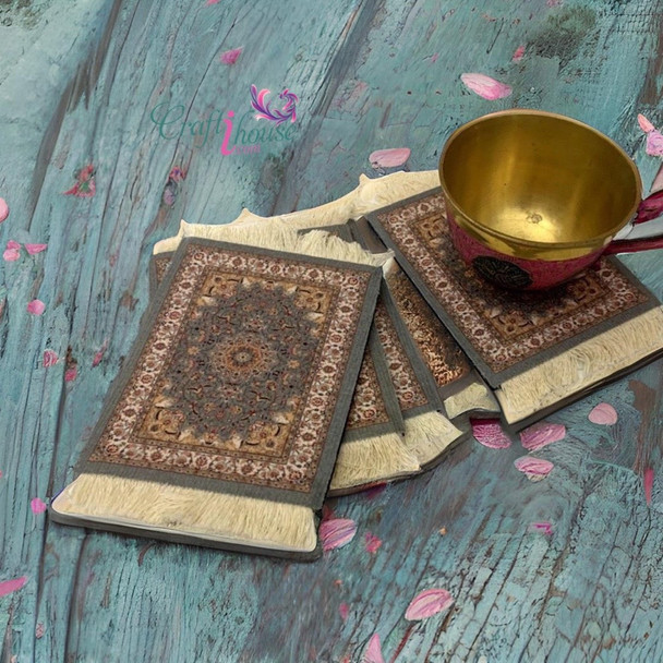 A professional product presentation of the exclusive Persian carpet coaster set from a premier UAE shop.