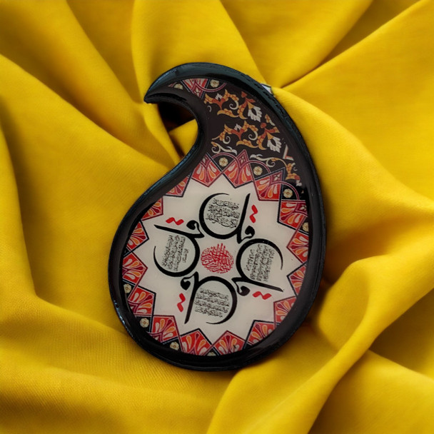 A professional product shot of the artistic teardrop wooden printed fridge magnet set against a clean, minimalist backdrop.