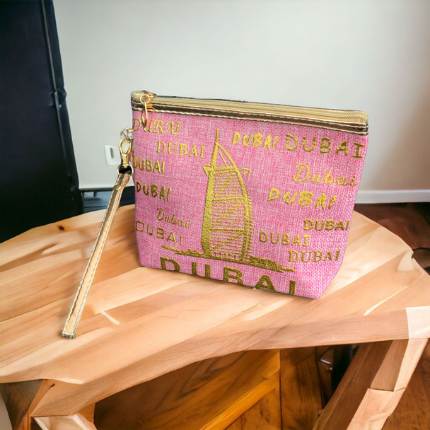 An exclusive product presentation of the pink Dubai souvenir pouch from a premier art, gift, and home decor supplier.