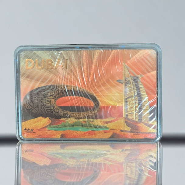 Detailed view of high-quality, shimmering gold foil playing cards featuring iconic Dubai landmarks.