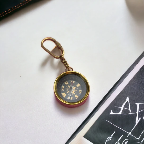 A professional product presentation of the vintage compass keychain from a premier art, gift, and home decor supplier.