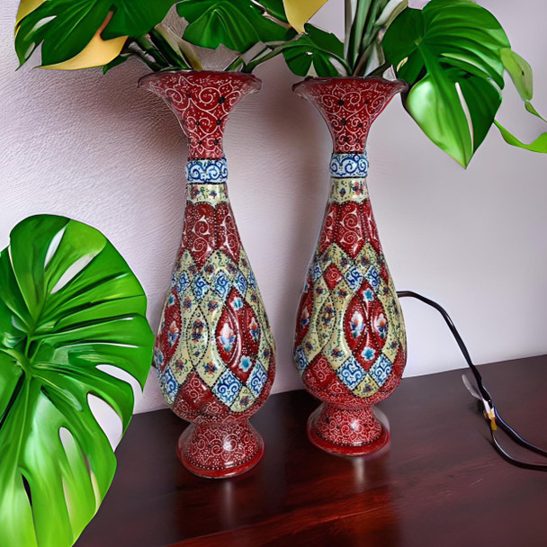 A premium set of two 30 cm hand-painted Meenakari copper vases titled "The Azure Twins" featuring vibrant blue and white floral enamel patterns.