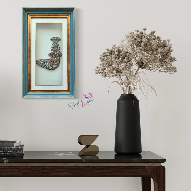 A premium 48x28 cm framed clay Dubai dagger titled "The Heritage Khanjar" featuring vibrant hand-painted pottery relief art.