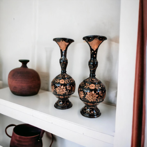 A set of 2 handcrafted 25 cm solid copper vases featuring intricate floral hand-engravings on a dark-weathered finish.