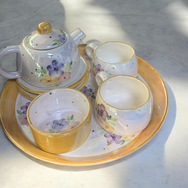 Luxury artisanal gift: Hand-painted leather handbag with carved wooden sides and circular handle, crafted by Craftihouse Dubai