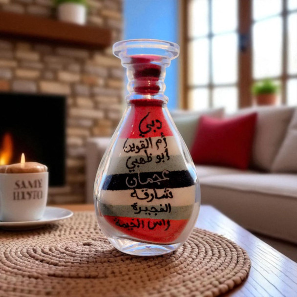 A 10 cm handcrafted glass bottle containing sand art from all 7 Emirates of the UAE.